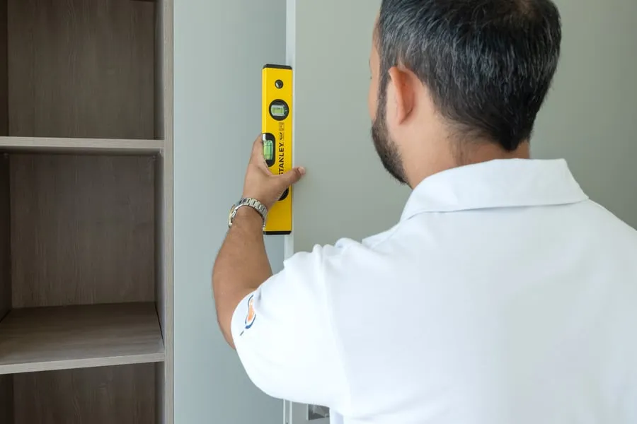 Spirit level against a wall
