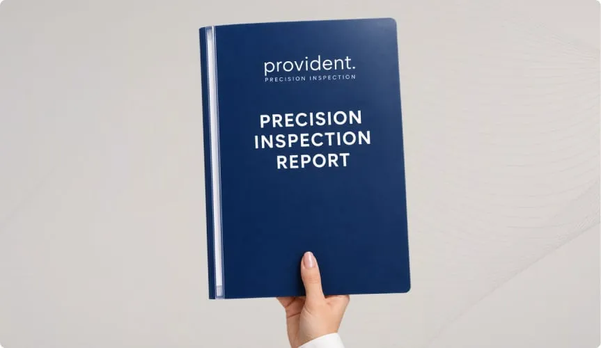 A hand holding the Precision Inspection report